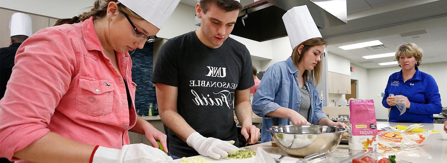 Students making food together